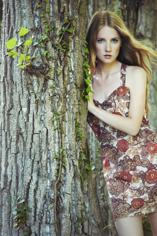320x480 wallpaper Leaning to tree, girl model, blue eyes, outdoor
