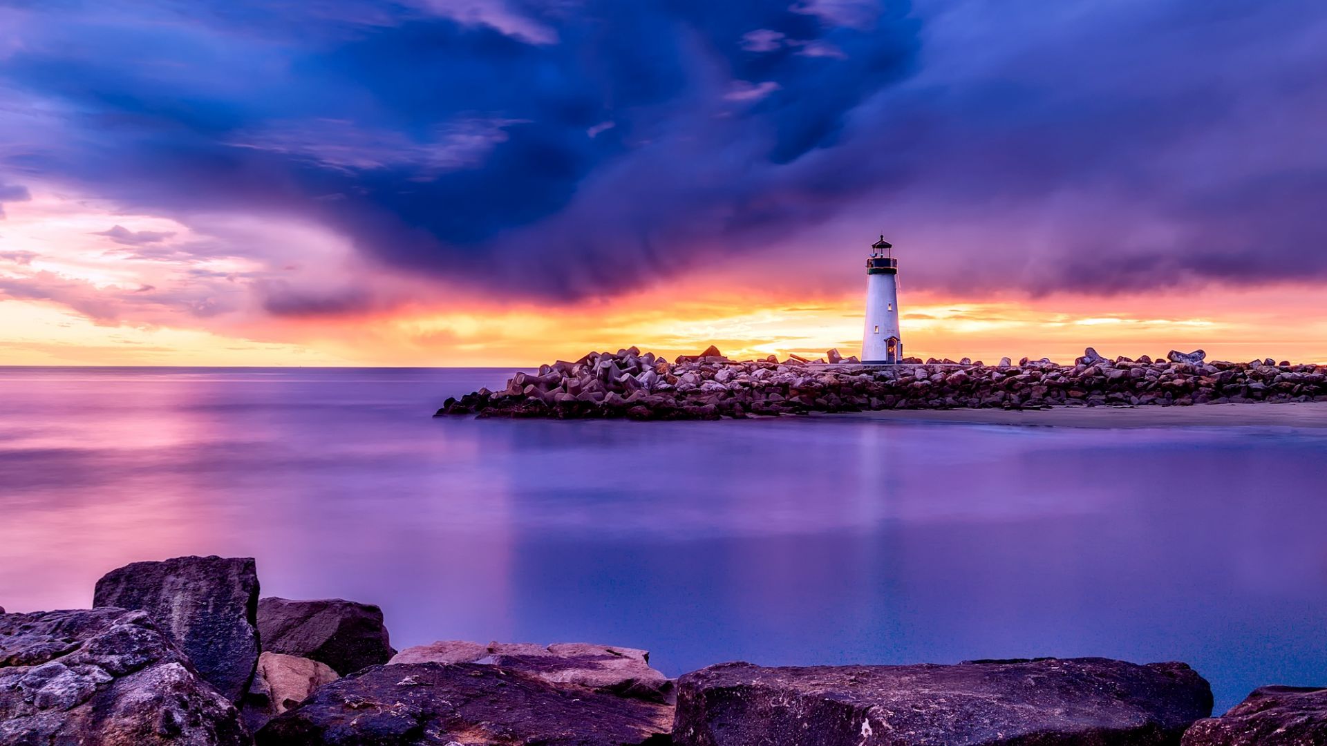 Wallpaper Rocks, lighthouse, sunset, sea, clouds, skyline