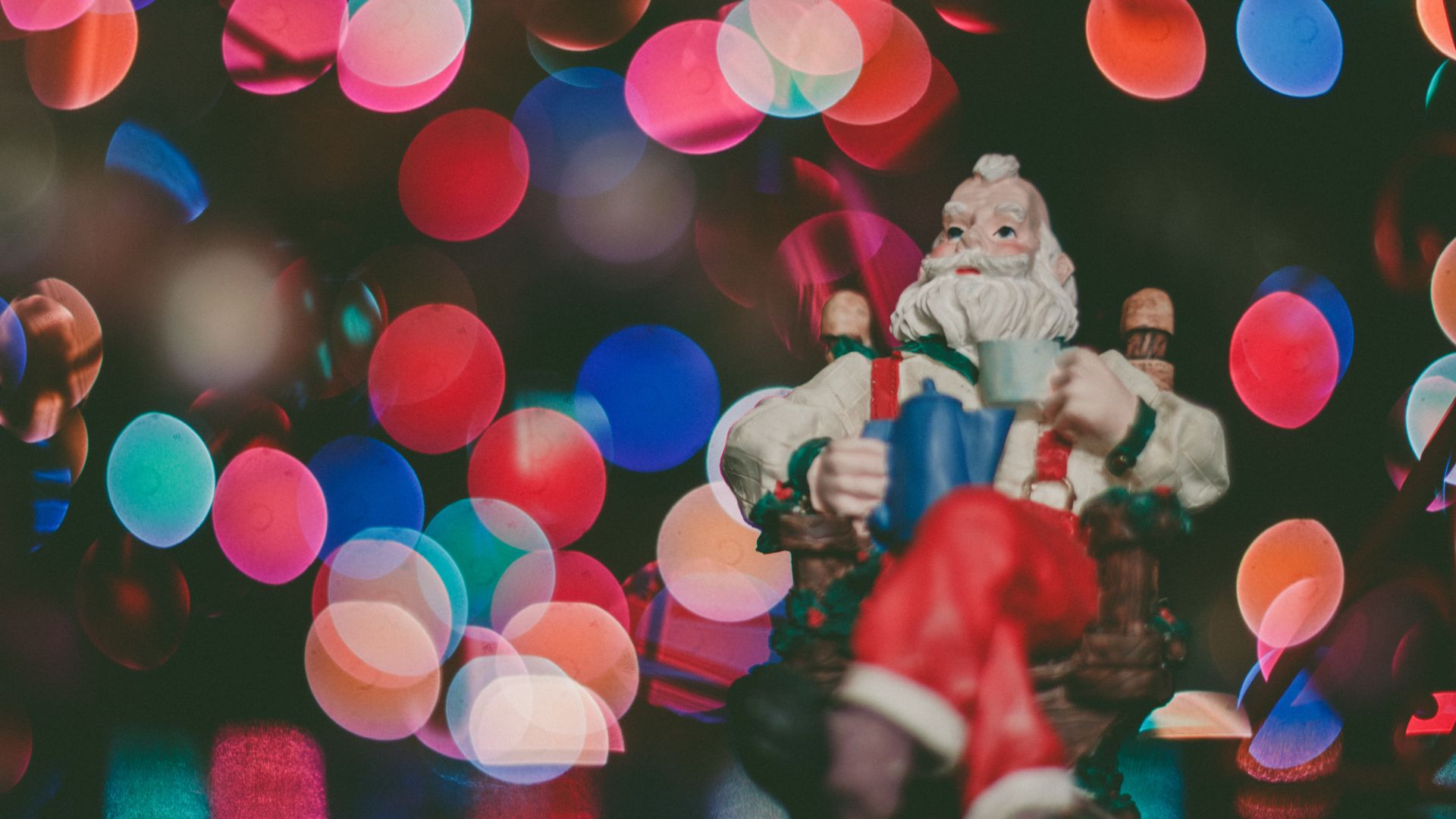 Wallpaper Santa Claus toy and bokeh Christmas lights