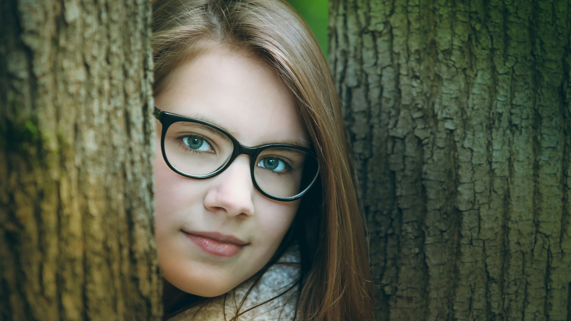 Wallpaper Young, girl model, brunette, tree trunks, glasses
