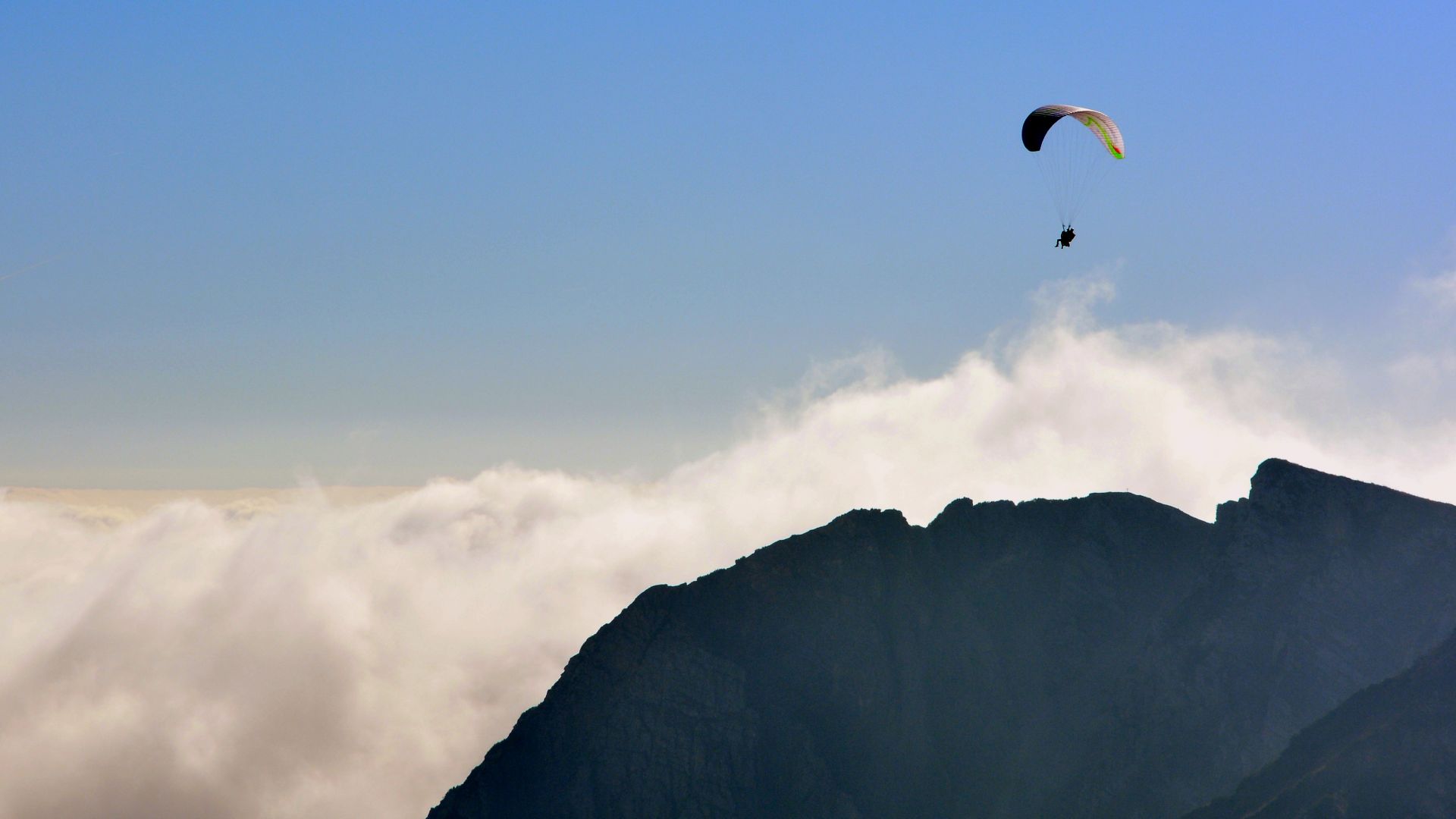 Wallpaper Paraglider flying sky mountains