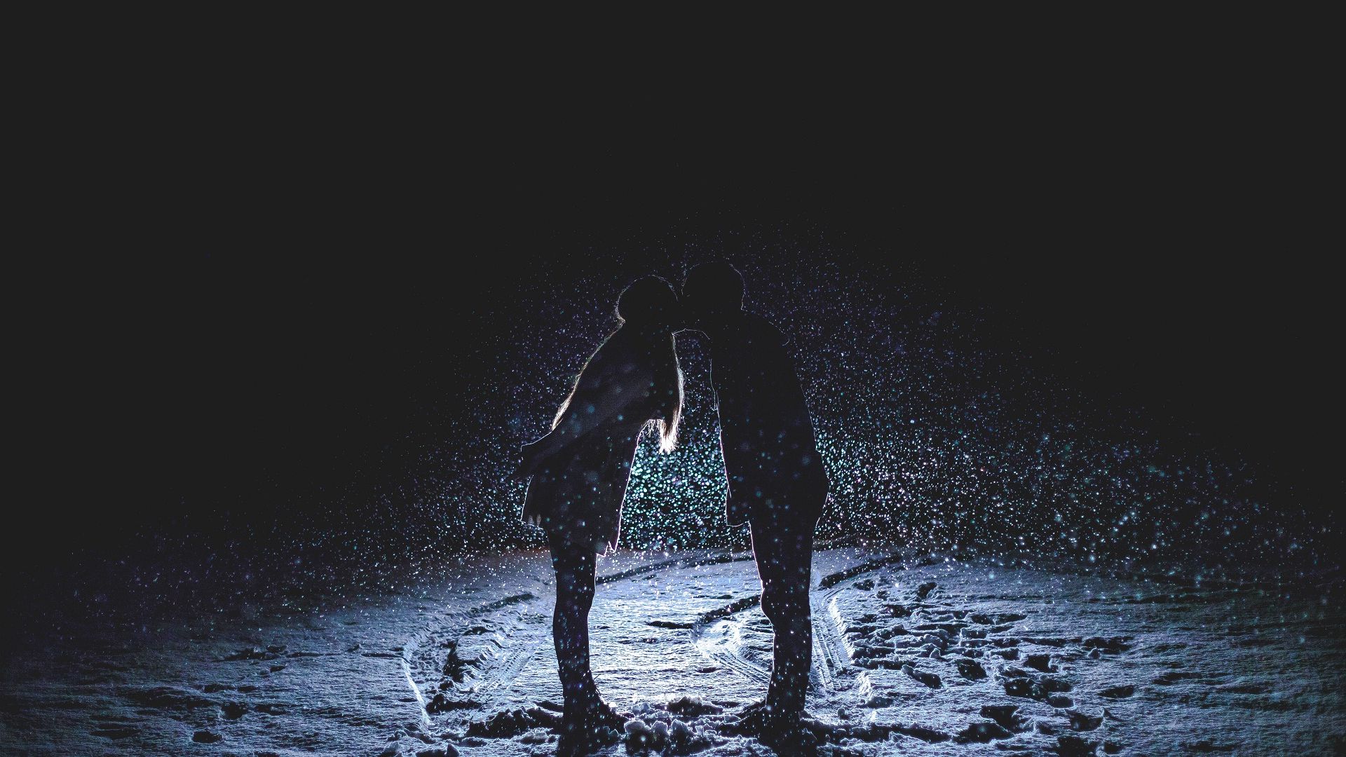 Wallpaper Kissing couple in rain at romantic night