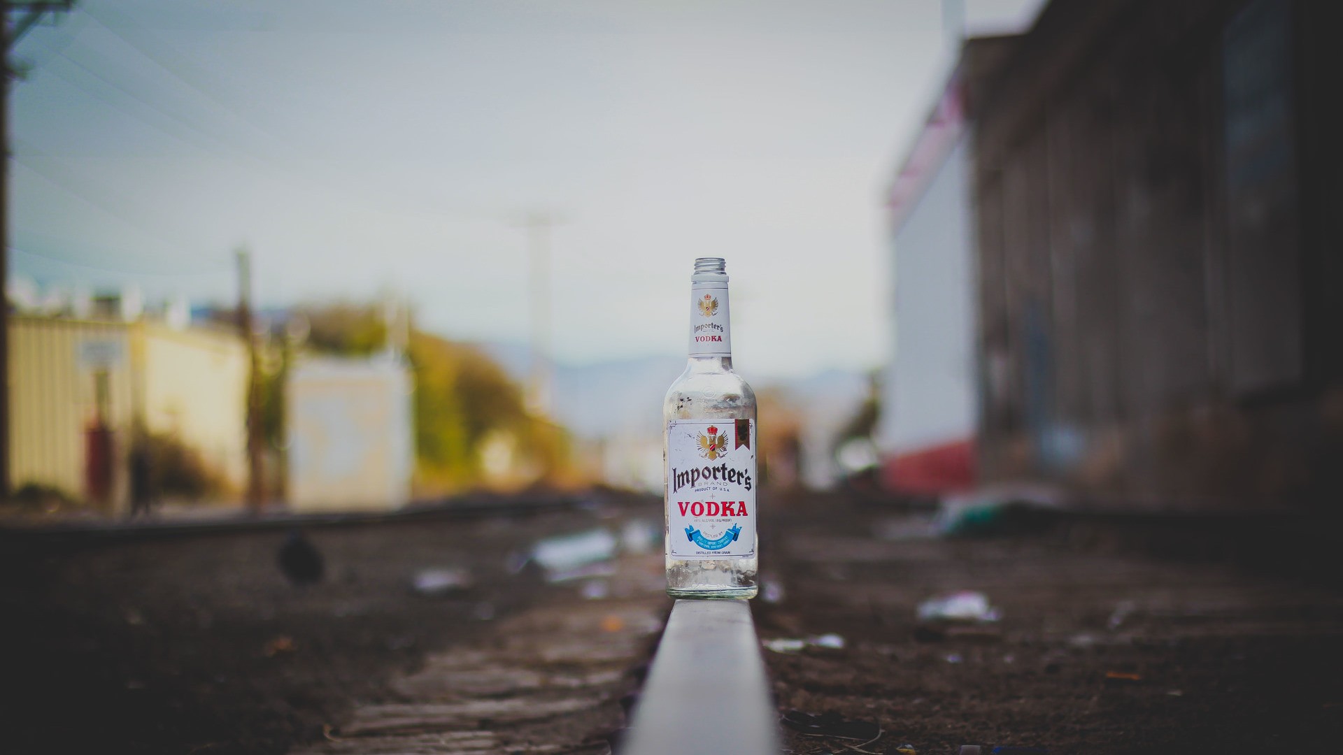 Wallpaper Vodka bottle on railroad