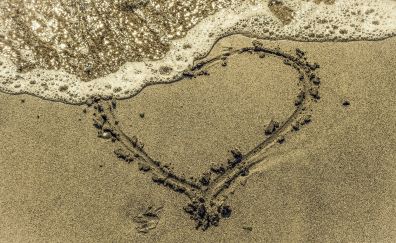 Faded heart at beach, sea waves