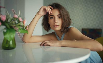 Relaxed, leaning to table, girl model