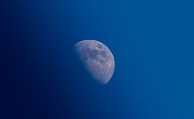 Blue sky, half moon, space