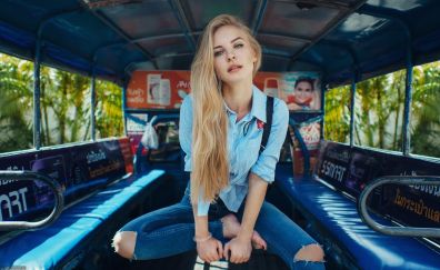Blonde girl in vehicle, model