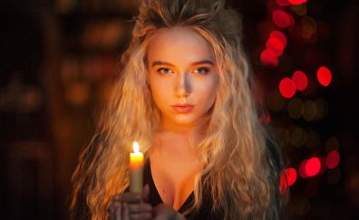 Woman with candle, bokeh, curly long hair, beautiful