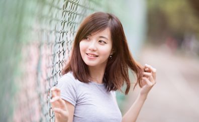 Asian model, girl, fence, looking away