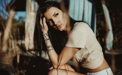 Girl model, short jeans, tattoo