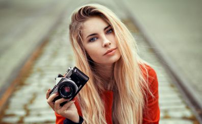 Blonde, girl model, with camera