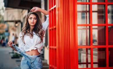 Girl model, telephone booth, jeans
