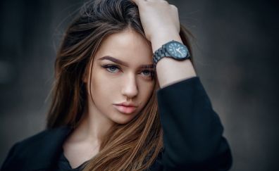 Model, hands on head, wristwatch