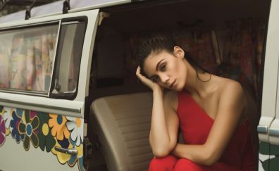 Girl model, sitting, van, brunette, red dress