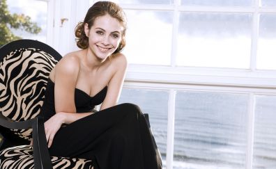 Lovely celebrity sitting on chair, Willa Holland, smile