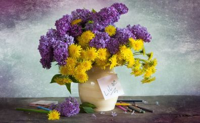 Purple & yellow flowers in vase