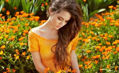 Girl model, orange flowers, meadow
