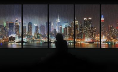 City in night through window