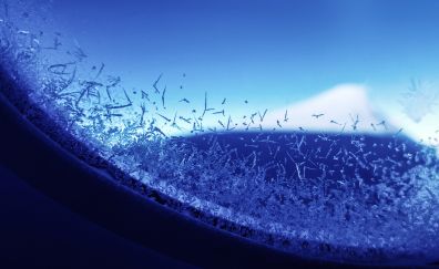 Flakes on window of aircraft