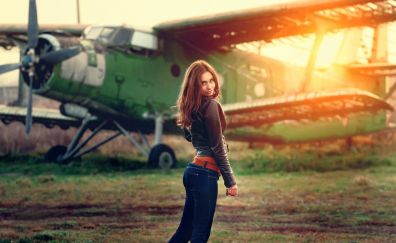 Airplane, girl, sunlight, smile, jeans